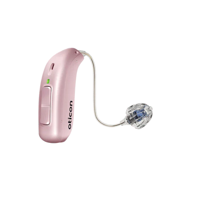 Pink hearing aid with clear tubing on a white background