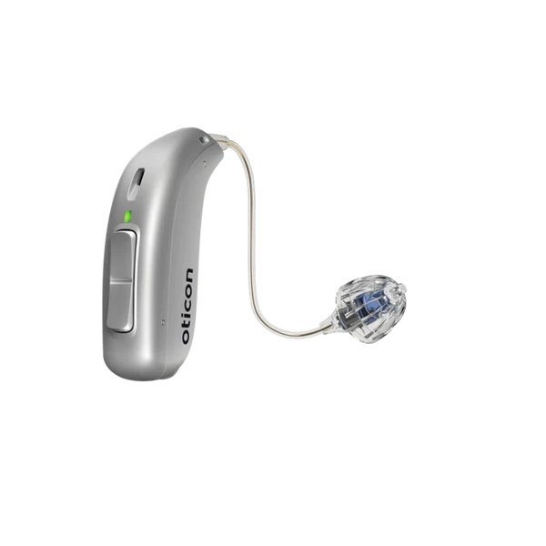Silver hearing aid with clear tubing on a white background