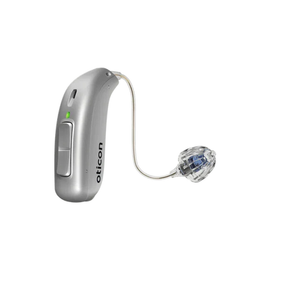 Silver hearing aid with clear tubing on a white background