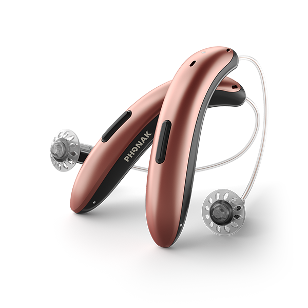 Rose gold Phonak hearing aid on a white background