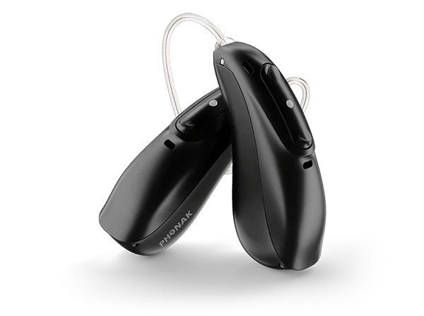 Pair of black hearing aids on a white background