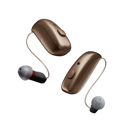 Pair of brown hearing aids on a clear background