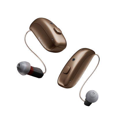 Pair of brown hearing aids on a clear background