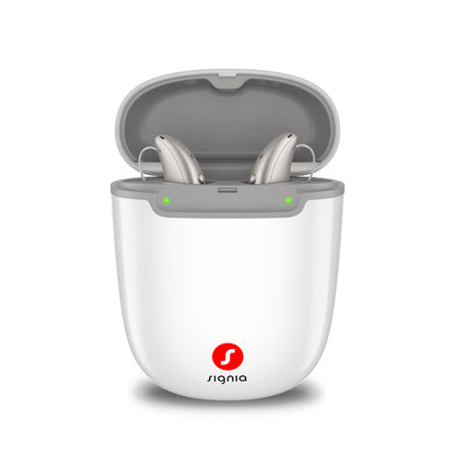 Signia Portable Charger Pure 2.0 holding a pair of Pure Charge&Go MaX hearing aids while they charge.