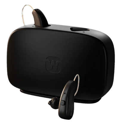Black wireless hearing aid system with a large rectangular receiver unit, a small in-ear hearing aid, and a thin connecting tube, shown on a plain white background.