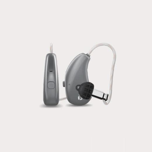Pair of gray hearing aids on a light gray background