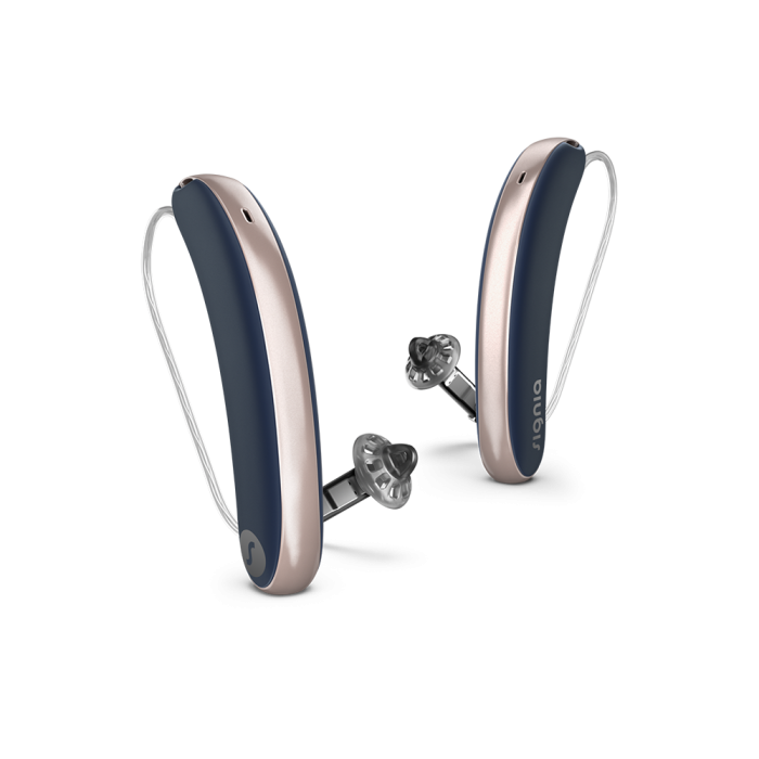 Pair of gray and silver hearing aids on a white background