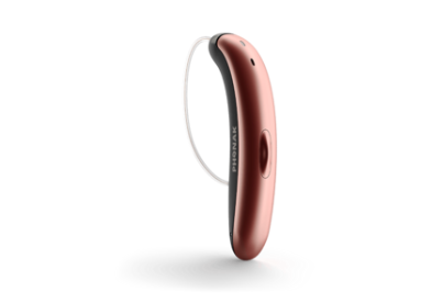 Rose gold hearing aid on a white background