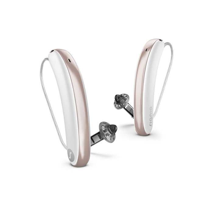 Pair of white hearing aids on a white background