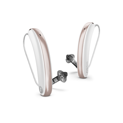 Pair of white hearing aids on a white background
